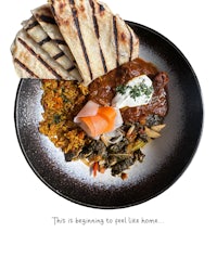 a black plate with food on it