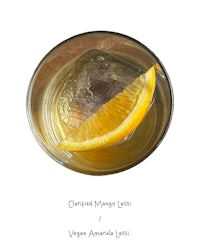 a cocktail with a slice of orange in it